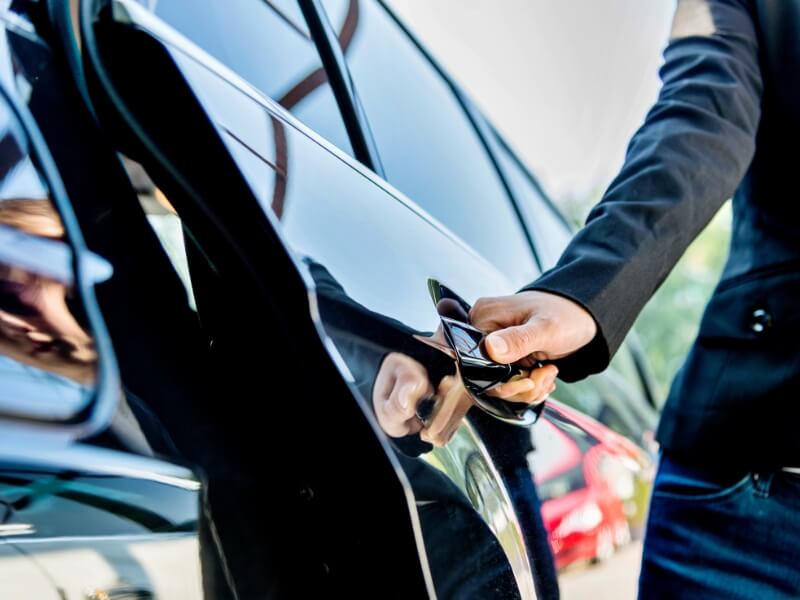 close up of hand opening car door