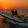 Boat Tarpon 790 LX driving on the Mediterranean Sea into the sunset