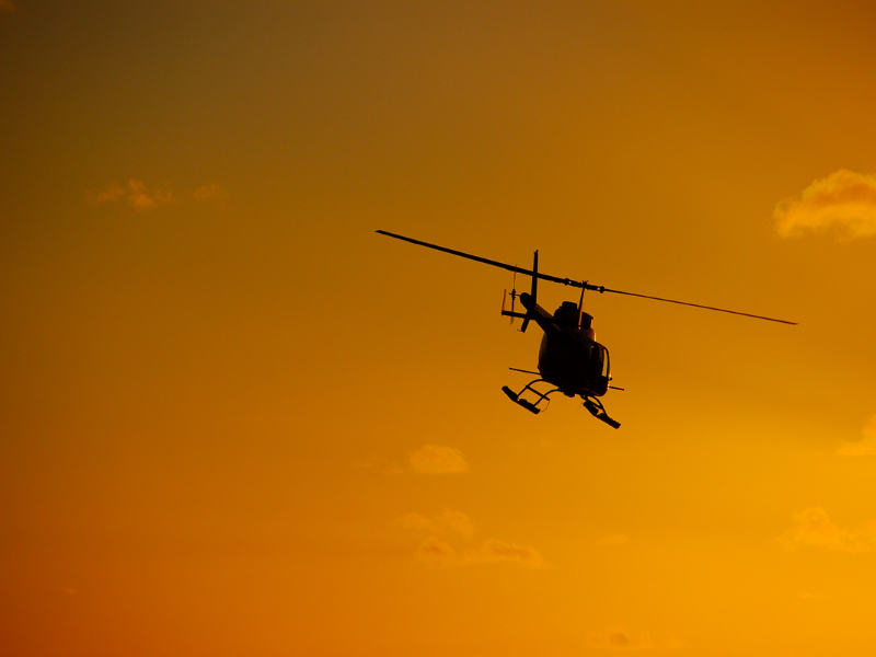 Jetranger Helicopter flying during sunset